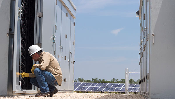 bess-worker-inspecting-unit