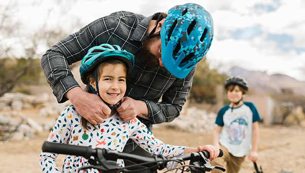 father-kids-biking father-kids-biking
